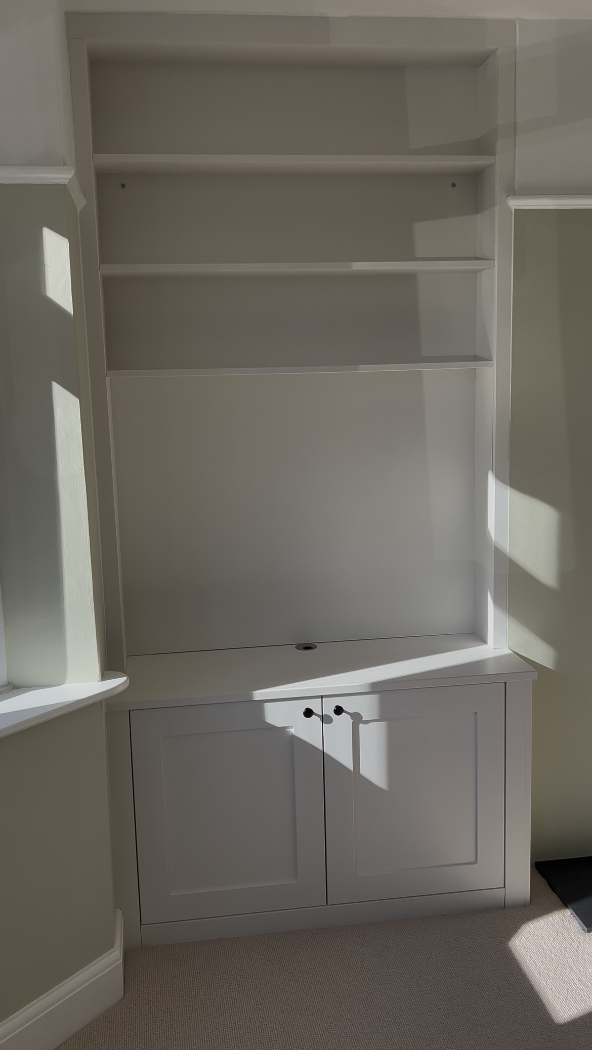 Fitted alcove cabinetry with floor-to-ceiling design, built by AJ Wroe in Wokingham