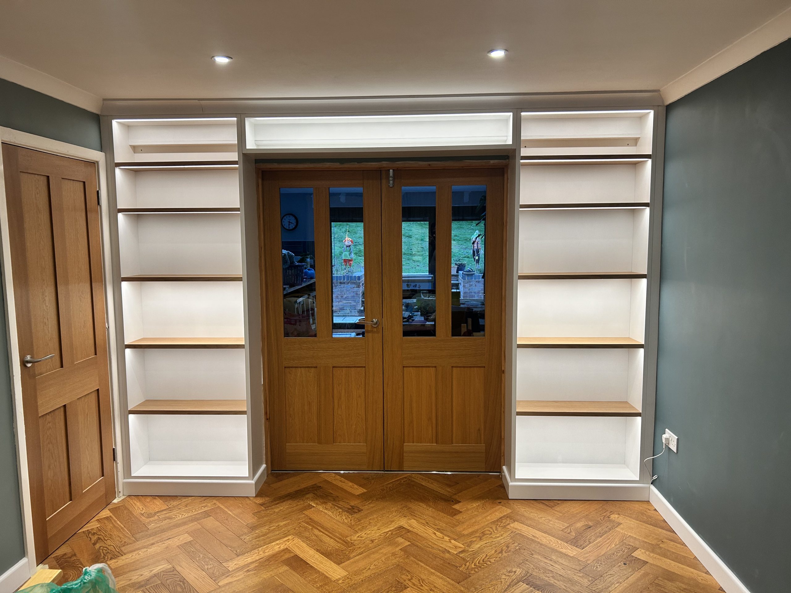 Bespoke fitted bookcase with LED lighting handcrafted by AJ Wroe, Reading Berkshire